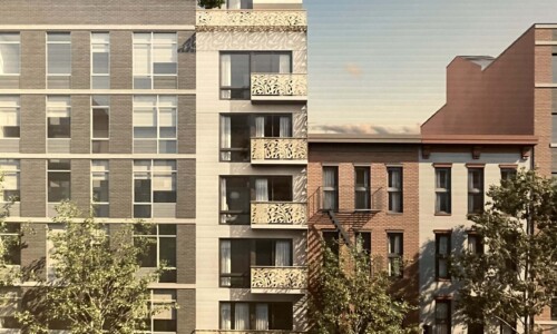 Modern urban apartment building with balconies.