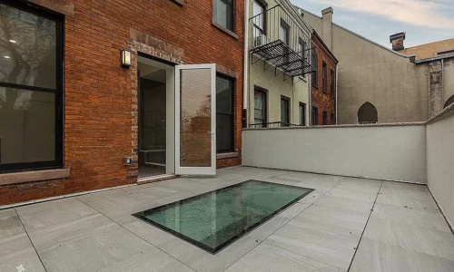 Rooftop terrace with glass floor panel.