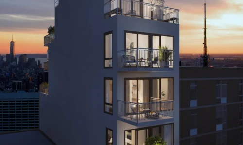 Modern apartment building at sunset.