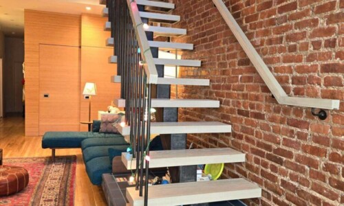 Open-riser staircase above blue tiled platform