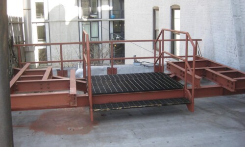Rooftop platform with metal safety railings.