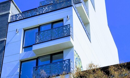 Modern multi-story building with balconies.